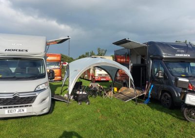 two Aeos horseboxes with shared tent